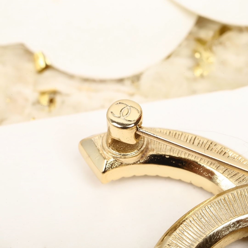 Ch**el brooches